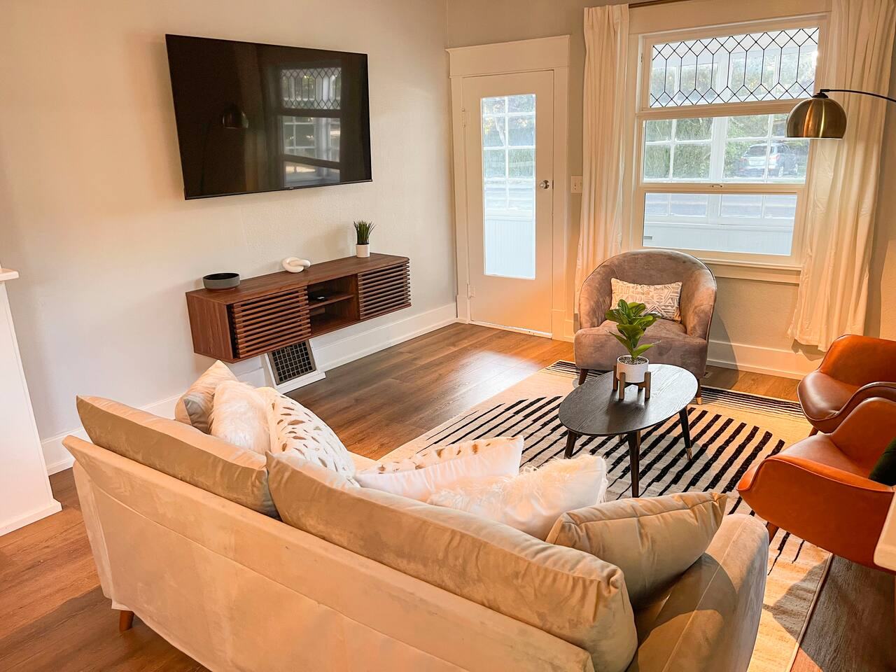 Living room with a large wall-mounted smart TV