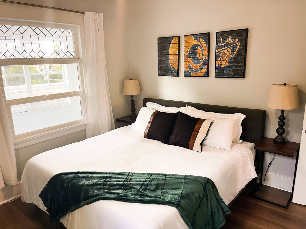 King bedroom with a leaded glass window