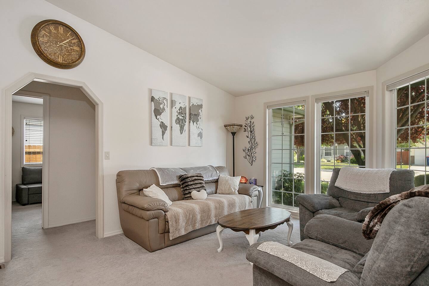 Living room with sofas, recliners and French doors