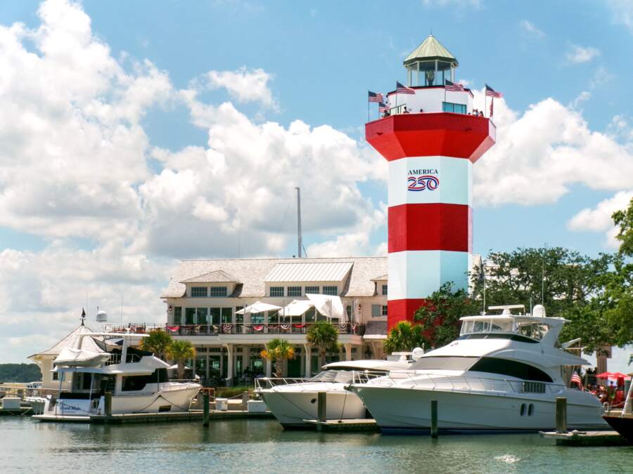 Red and white Harbour Town Lighthouse above the marina on Hilton Head Island