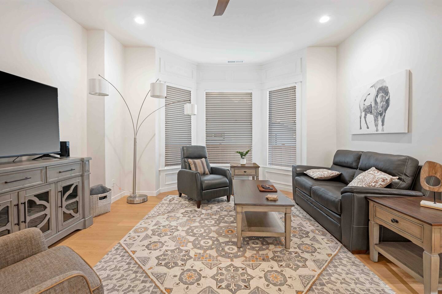 Living room with leather sofa, recliner and Smart TV
