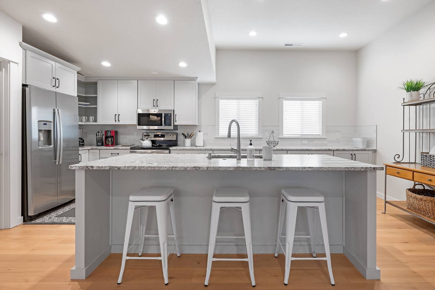 Kitchen island with three bar stools