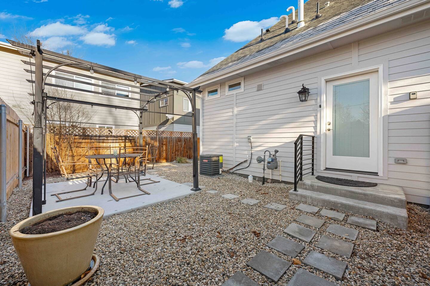 Private back patio with outdoor dining table