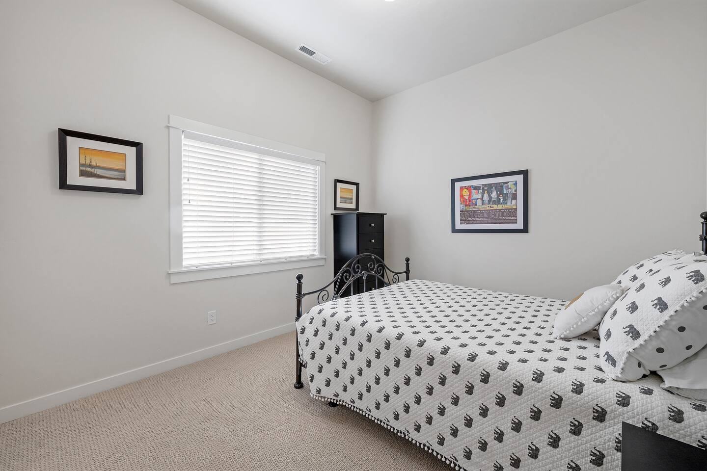 Queen bedroom with iron bed frame