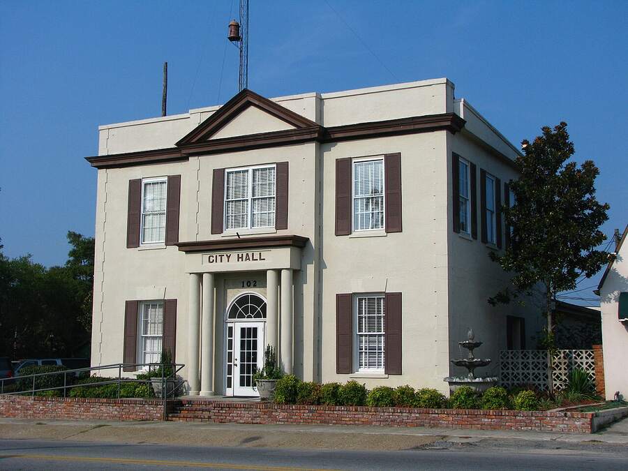 Hahira City Hall, a two-story cream building with dark shutters