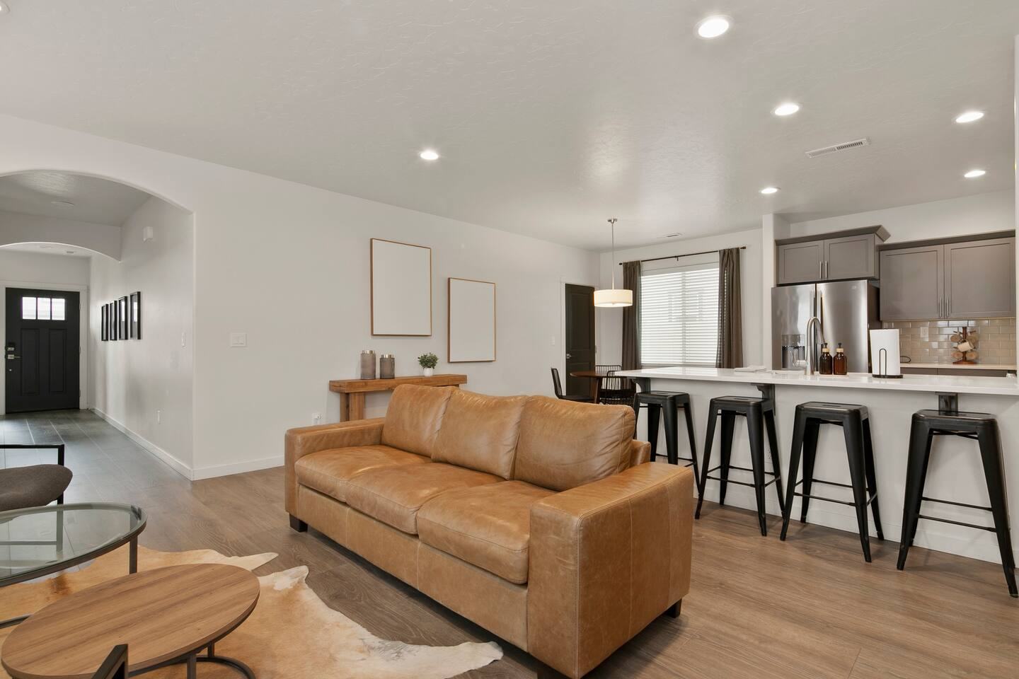 Living area flowing into the kitchen island and front entry