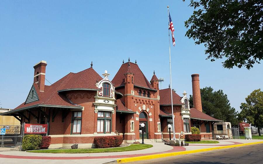 The red brick Nampa Train Depot with its curved gables
