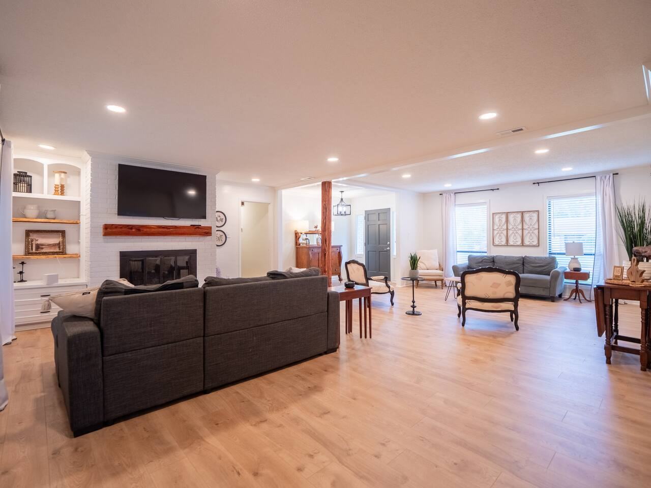 Great room with sectional sofa, TV and fireplace surround