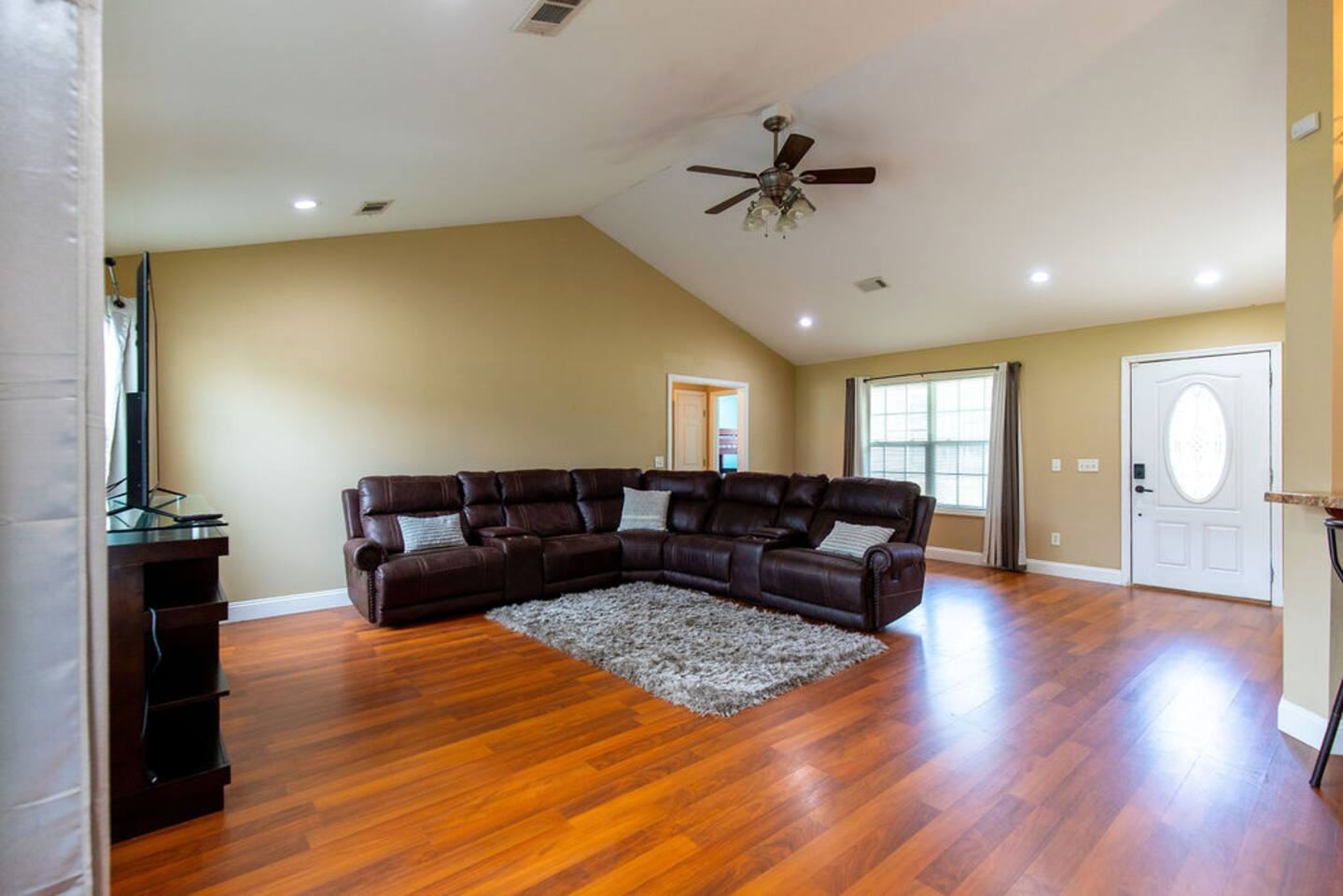 Leather sectional and shag rug in the vaulted great room