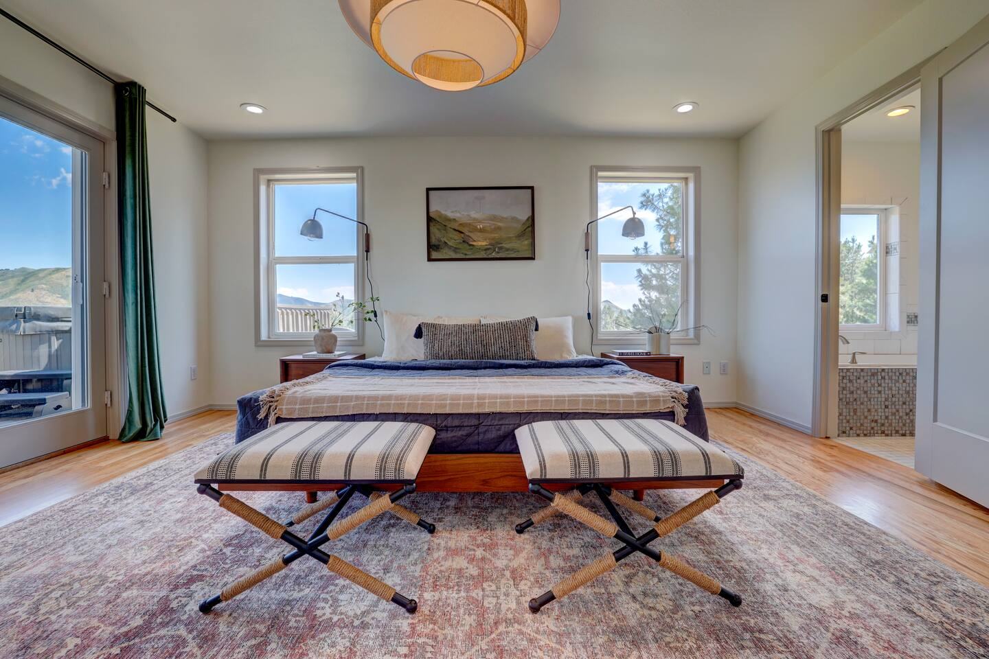 Primary bedroom with king bed and bench