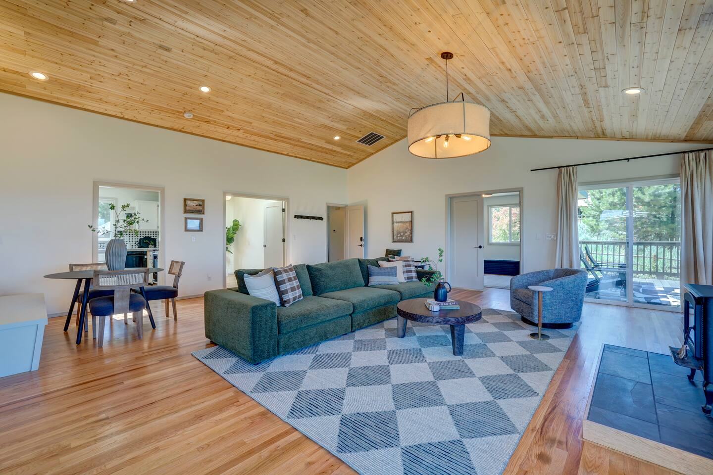 Open living and dining area with mountain-view windows