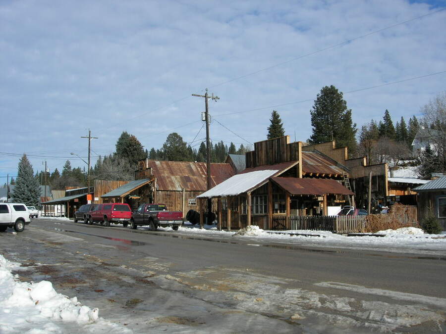 Wooden storefronts on the main street of Idaho City in winter