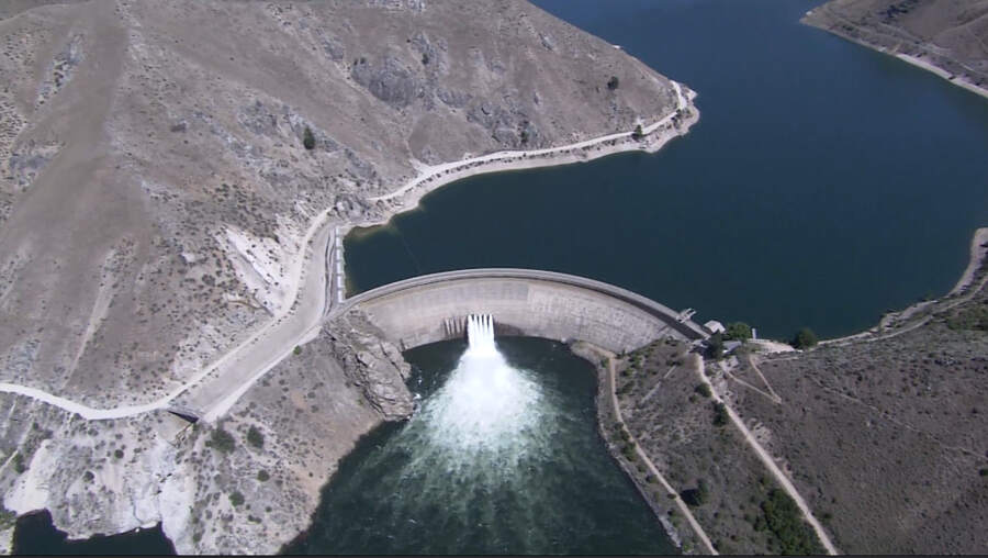 Aerial view of Arrowrock Dam releasing water into the Boise River canyon