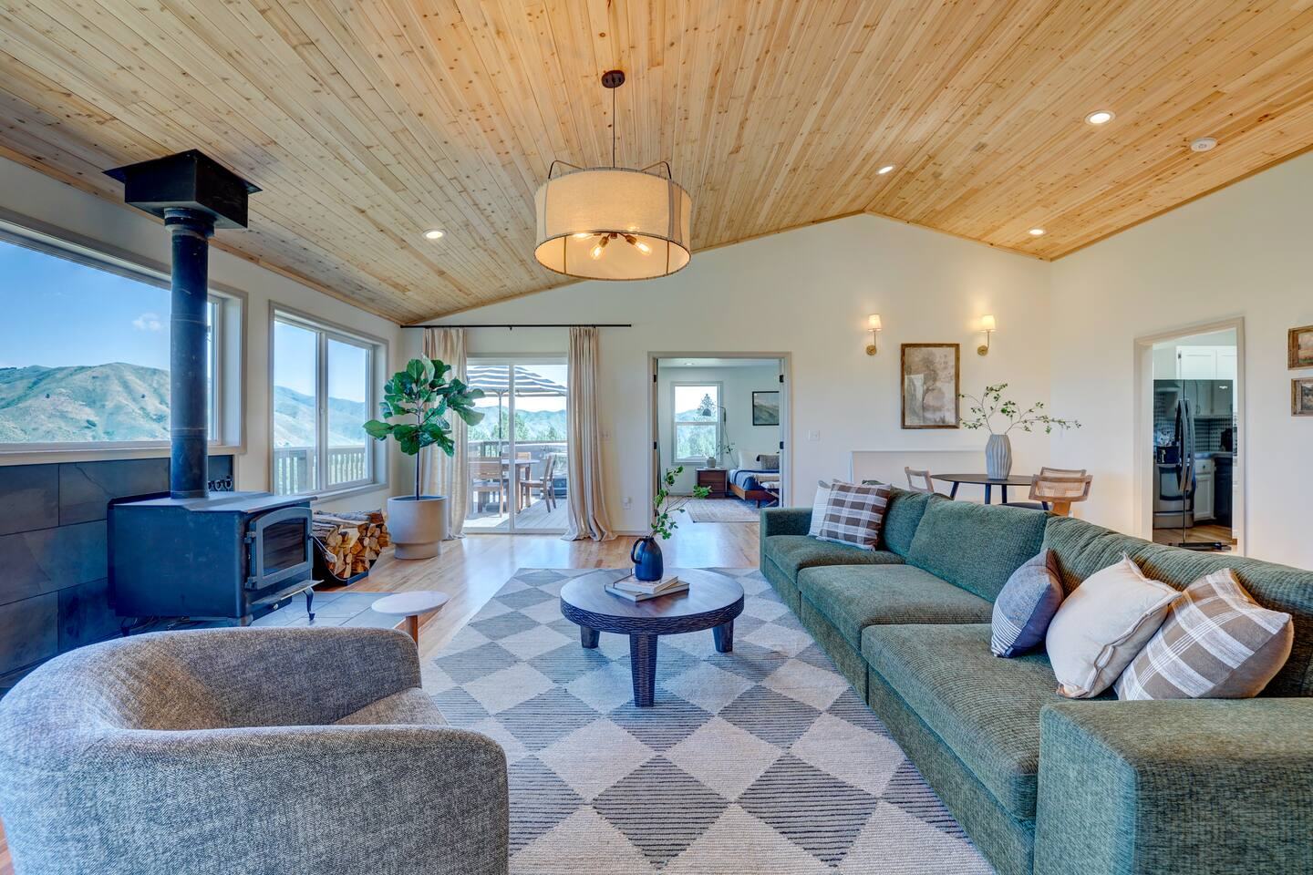 Living room with fireplace and deck views