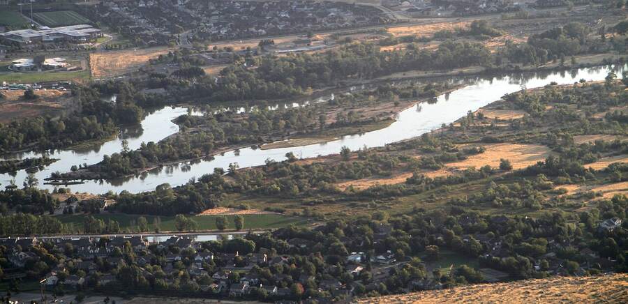The Boise River winding through cottonwoods and the Greenbelt